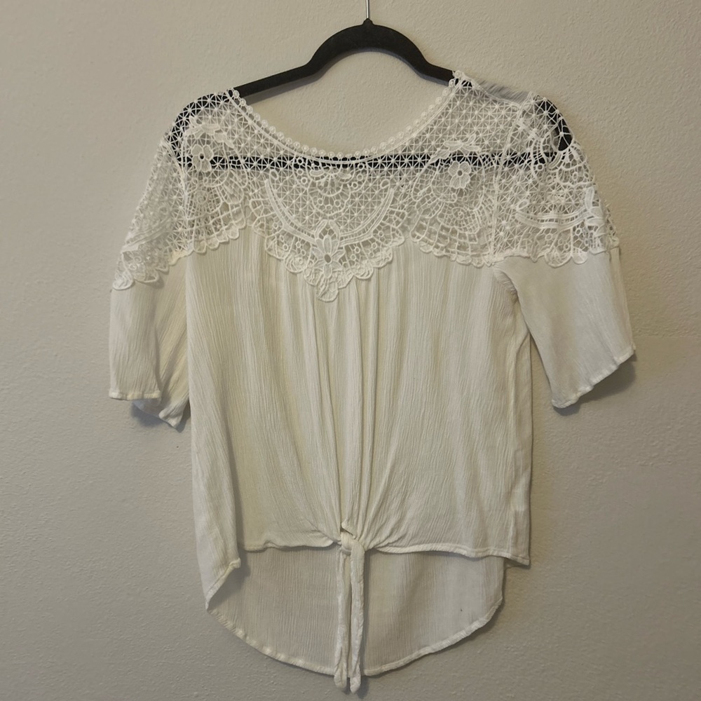 This top is a medium LUQ. It is sheer and needs a camisole underneath.